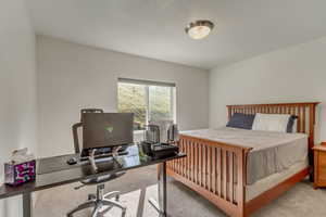 Bedroom with light carpet