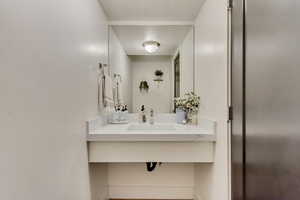 Bathroom with vanity and a textured ceiling