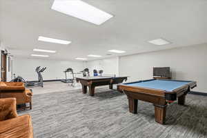 Rec room with carpet floors and billiards