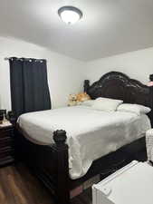 Bedroom with wood finished floors