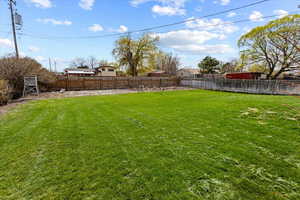 View of yard featuring a fenced backyard