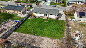 Birds eye view of property with a residential view