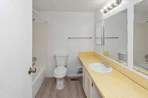 Bathroom with visible vents, shower / bathing tub combination, and toilet