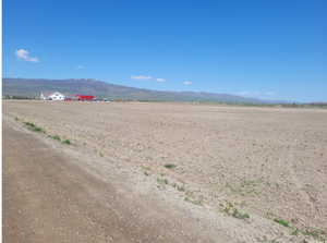 Property view of mountains featuring a rural view