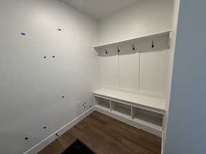 Mudroom with baseboards and wood finished floors