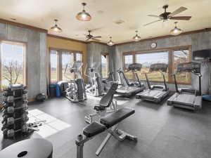 Community exercise room featuring a ceiling fan and visible vents