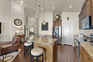 Large custom island can seat up to 6 guests
