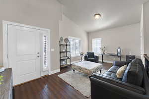 Spacious, open front living room with soaring ceilings