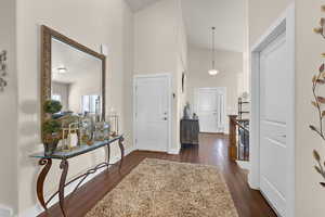 Spacious foyer beyond the front room. Laundry door is to the right. Garage entrance door is to the left.