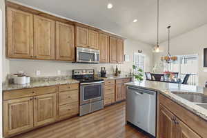 Enjoy plentiful cabinets and stainless steel appliances