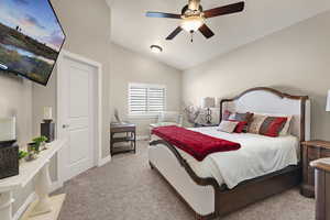 Primary bedroom features an extra nook, brand new carpet and vaulted ceilings