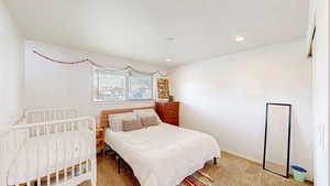 Bedroom with recessed lighting, baseboards, and carpet floors