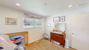 Bedroom featuring carpet flooring, baseboards, visible vents, and recessed lighting