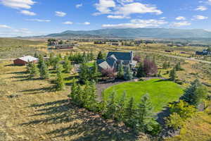 Aerial view featuring a rural view and a mountain view