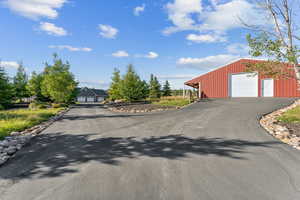 View of street with aphalt driveway