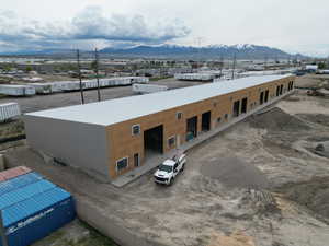 Birds eye view of property with a mountain view