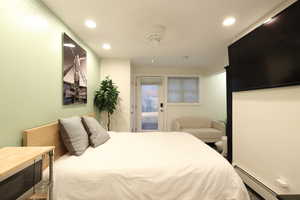 Apartment with access to outside, a baseboard radiator, and recessed lighting