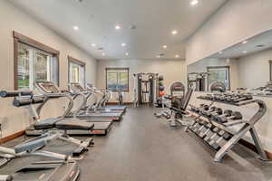 Exercise room featuring baseboards and recessed lighting