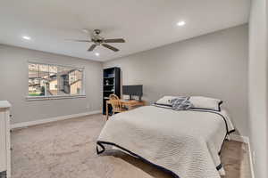Carpeted bedroom with baseboards, recessed lighting, and ceiling fan