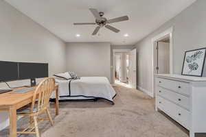 Bedroom with light carpet, recessed lighting, baseboards, and a ceiling fan