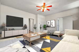 Living room featuring light colored carpet, a ceiling fan, and crown molding