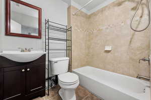 Bathroom featuring visible vents, toilet, shower / bathing tub combination, and vanity