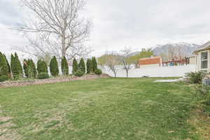 View of yard featuring fence