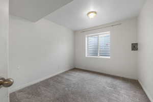Empty room with baseboards and carpet floors