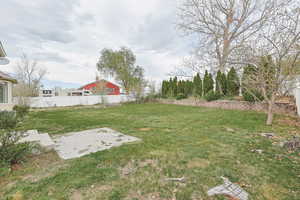 View of yard featuring fence