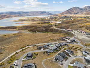 Aerial overview of property's location with a water and mountain view