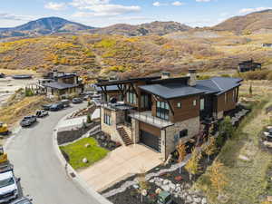 View of subject property featuring a mountainous background