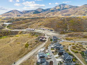 Aerial view of property's location featuring mountains