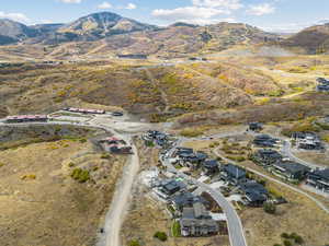 Aerial view of property and surrounding area with mountains