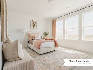 Bedroom with baseboards, visible vents, and carpet floors