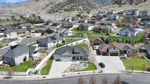 Birds eye view of property with a residential view and a mountain view