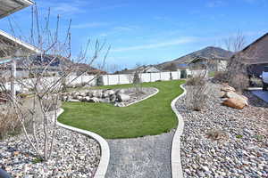 View of yard featuring a fenced backyard and a mountain view