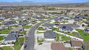 Drone / aerial view featuring a mountain view and a residential view