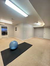 Exercise room or additional bedroom with sitting area.