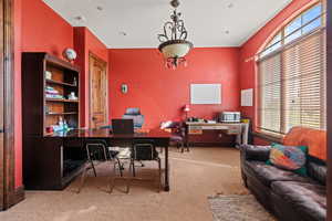 Office space with plenty of natural light and carpet