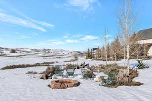 View of yard layered in snow