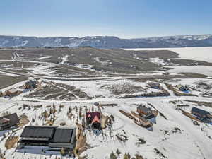Snowy aerial view with a mountain view