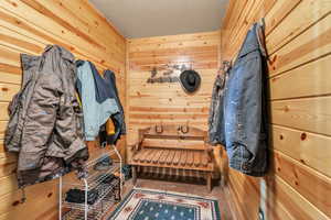 Mudroom with wood walls