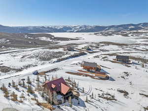 Snowy aerial view with a mountain view