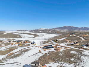 Snowy aerial view with a mountain view