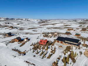 Snowy aerial view featuring a mountain view