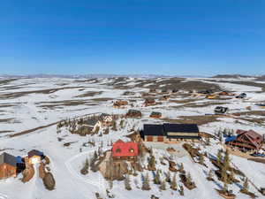 Snowy aerial view with a mountain view