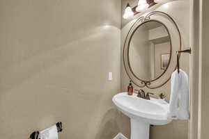 Bathroom featuring a textured wall