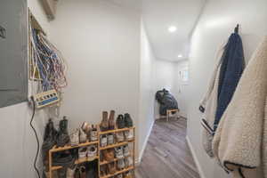 Corridor featuring baseboards, recessed lighting, and wood finished floors