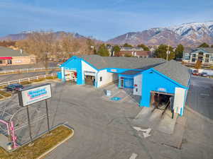 Exterior space with fence and a mountain view