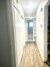 Hallway with light wood finished floors